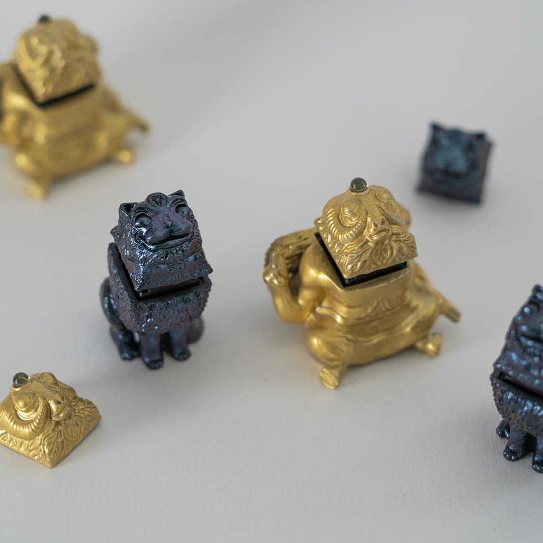 Handcrafted gold and metallic keycaps display